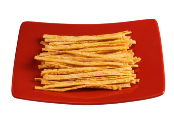 Fish sticks on red plate.