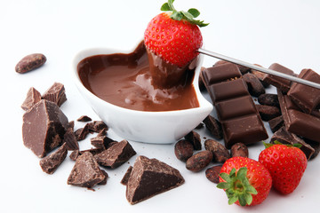 Fondue with Melting chocolate or melted chocolate and strawberry.
