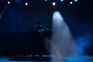 dj performing on a stage