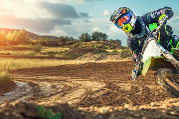 Extreme Motocross MX Rider riding on dirt track - obrazy, fototapety, plakaty