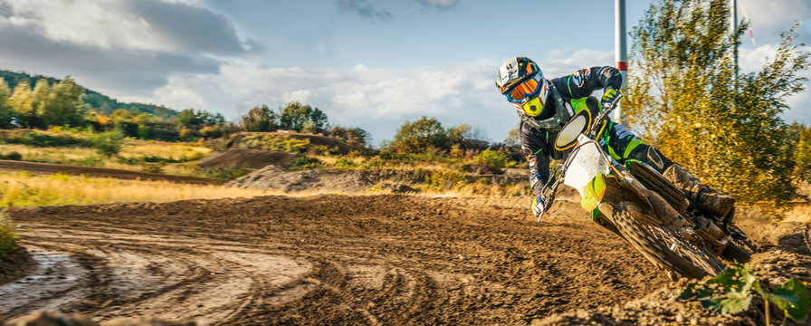 Extreme Motocross MX Rider riding on dirt track