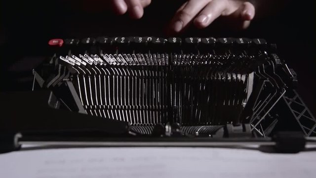 Script writer on a typewriter writes a screenplay for the film