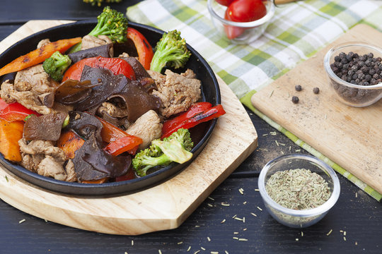 Beef meat with vegetables in a frying pan, Asian cuisine
