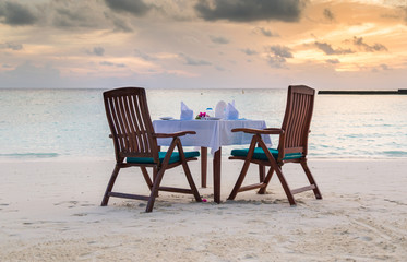 Romantic beach dinner with sunset