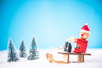 Santa have fun on snow sledge, winter and Christmas time