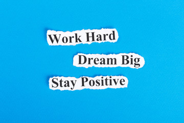 Work Hard, Dream Big, Stay Positive text on paper. Word Work Hard, Dream Big, Stay Positive on torn paper. Concept Image
