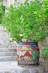 An old barrel with painted houses 