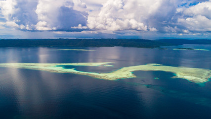 Small coral island near Raja Ampat . West Papua, Indonesia.