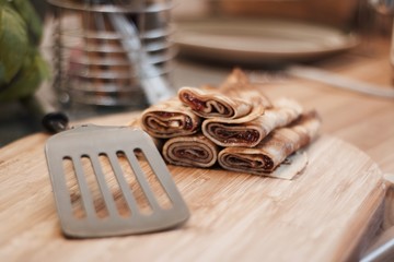 Tasty pancakes on the wooden board