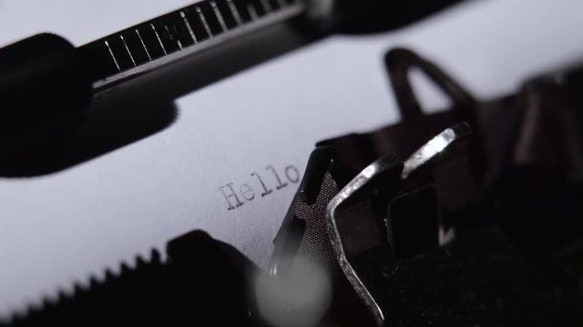 Poet types the text of the poem on a retro typewriter