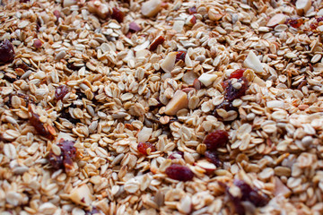 Oven roasted homemade honey granola on baking sheet
