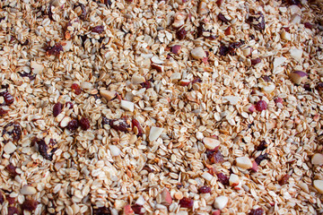 Oven roasted homemade honey granola on baking sheet
