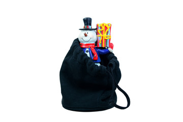 snowman with gift box in black bag on white background isolated