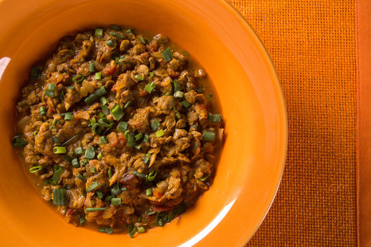 Sururu soup inside a orange plate. Brazilian dish.