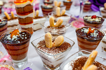 sweet cakes and candies decorated on the table. wedding or birthday decorated table.