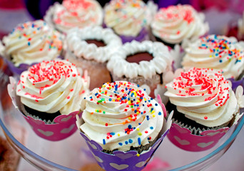 sweet cakes and candies decorated on the table. wedding or birthday decorated table.