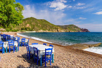 Fototapeta na wymiar Traditional Greek taverna on Lambi beach, Patmos island, Dodecanese, Greece