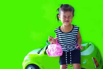 .Little girl with a mini car