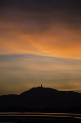 Fototapeta premium Phuket big buddha on top hill with sunset 