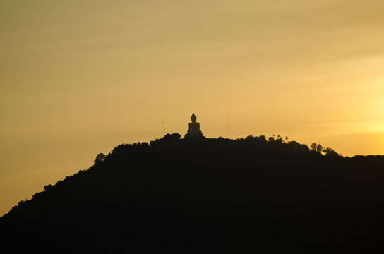 Phuket big buddha on top hill with sunset 