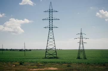 
Minimalism. Industrial landscape. Electric towers in the field