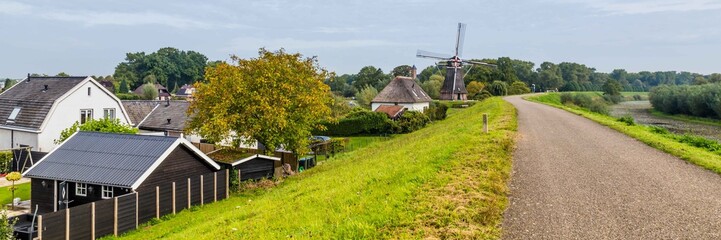 Dutch windmill on a dike