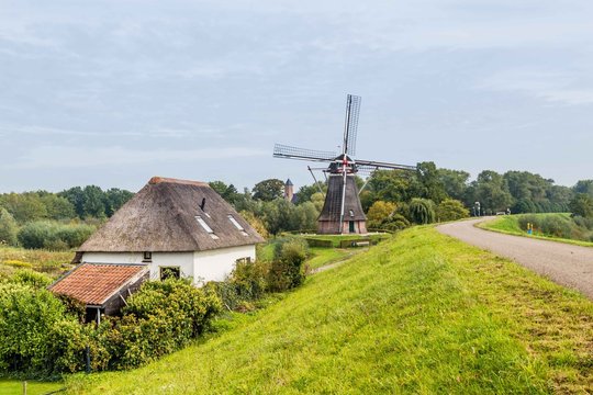 Dutch windmill on a dike