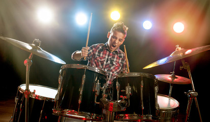 teenage boy behind drum kit