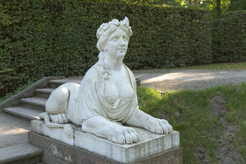 Sculpture of a lion with a half-naked woman's head