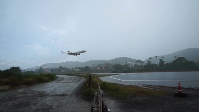 Airplane Landing in Heavy Rain