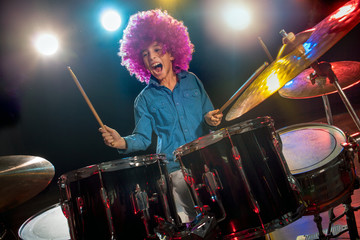 young boy playing drums