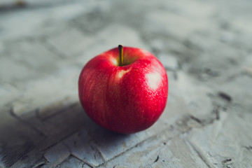 ripe red Apple concrete background