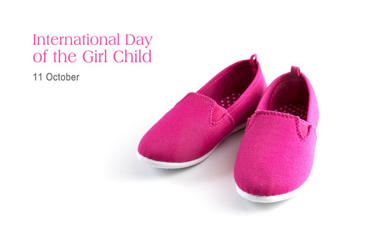 pink kid shoes isolated on a white background, text  International day of the girl child, 11 October, copy space