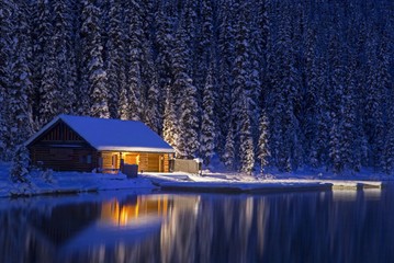 Night View of Lake Louise Canoe Rental Log Cabin in Winter.  Banff National Park, Rocky Mountains...