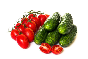 vegetables cucumbers and tomatoes on a white background