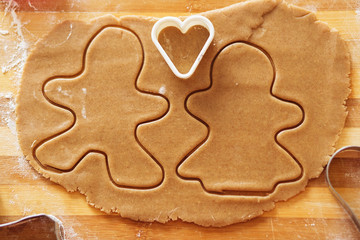 Homemade gingerbread cookies, forms and baking ingredients.