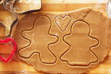 Homemade gingerbread cookies, forms and baking ingredients.