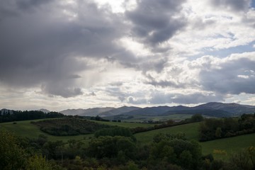 Fototapeta na wymiar Dramatic clouds, rain in distance. Slovakia