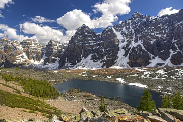 Panoramic Landscape View of Eiffel Lake and Distant Snowy Rocky Mountain Tops above Valley of Ten Peaks, Banff National Park, Alberta, Canada