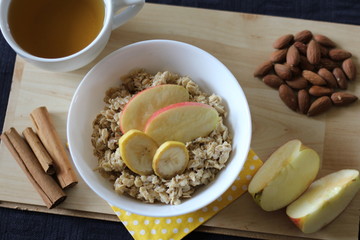 Porridge with apple, banana, almonds (healthy breakfast)