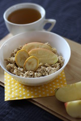 Porridge with apple, banana, almonds, cinnamon (healthy breakfast)