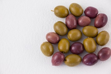 Overhead view of green and brown olives
