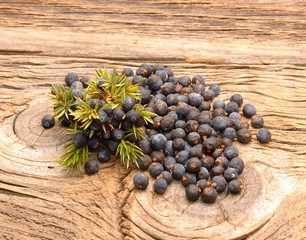  Juniper berries on a wooden background