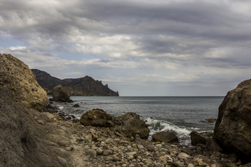 Fototapeta na wymiar landscape of a famous rock formations, bays near the extinct volcano Karadag Mountain in KaraDag reserve in north-east Crimea, Black sea