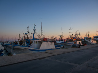 Fishing boats in Trapani harbour in the sunset light
