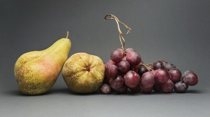Still life with various ripe fruit, isolated on grey