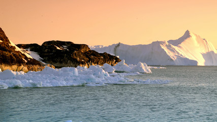  Arctic Icebergs in Greenland. You can easily see that iceberg is over the water surface, and below...