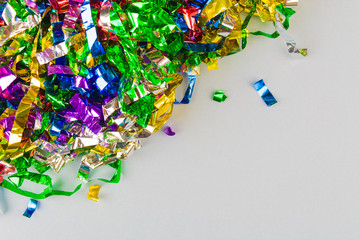 Fototapeta na wymiar Colorful festive confetti over gray background