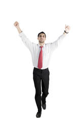 Successful Arabian businessman running on studio