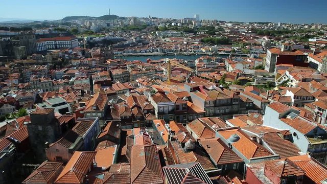 Oporto urban landscape on Douro River and city skyline from Clerigos Tower, the highest point in the city of Porto. Cathedral or Se do Porto and Episcopal Palace or Paco Episcopal on background.